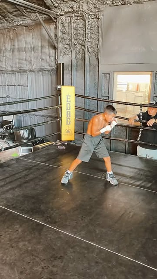 Young boxer shadowboxing in the full-size ring at EGBG boxing gym in Dallas